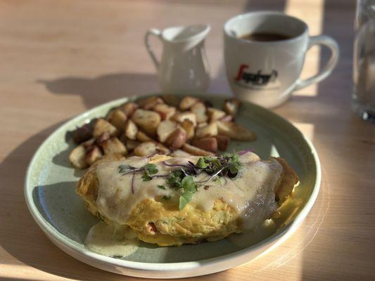 Lobster  omelette with a side of rosemary potatoes. Coffee was delicious