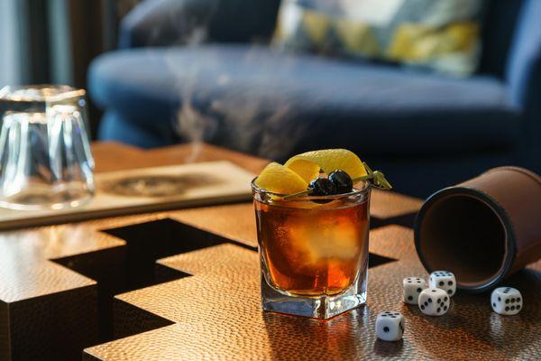 Smoked Maple Old Fashioned - Woodford Reserve, maple syrup, orange slide and cherry.