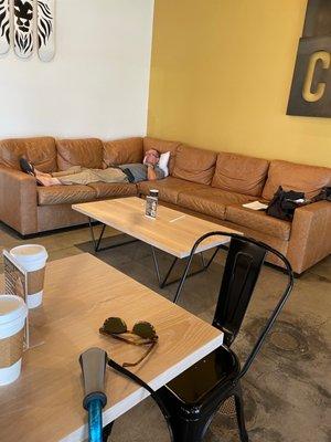 Man spread out on two couches