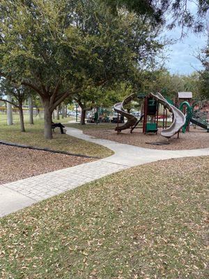 Picnic tables and 2-5 year old slides and baby swings in the back.