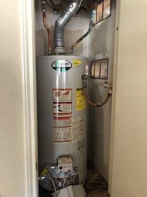 Water heater leaking BEFORE picture. Removed and installed On-demand tankless water heater.