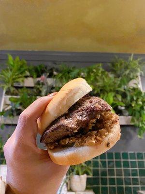 Juicy Lucy outside with cooked onions