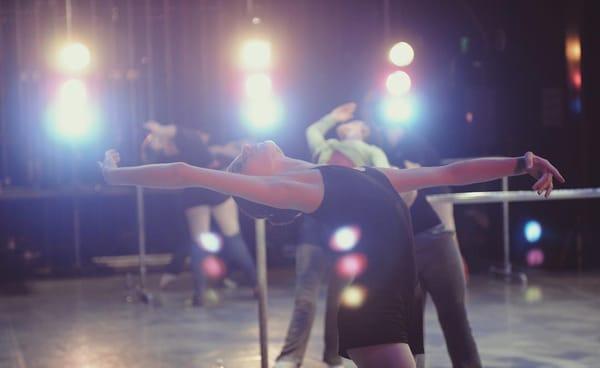 IBA Dancers training on stage.