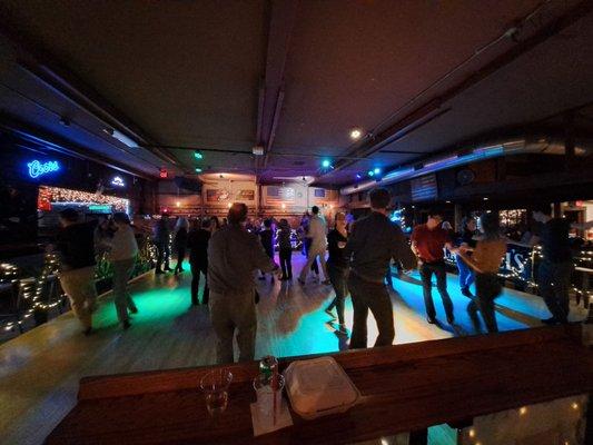 Tuesday night West Coast Swing dance social goes from 8 PM to 11:30 PM. Dance floor comfortably holds about 15 couples.