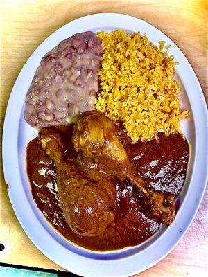 Chicken mole sweet but mild spice chicken with rice and beans