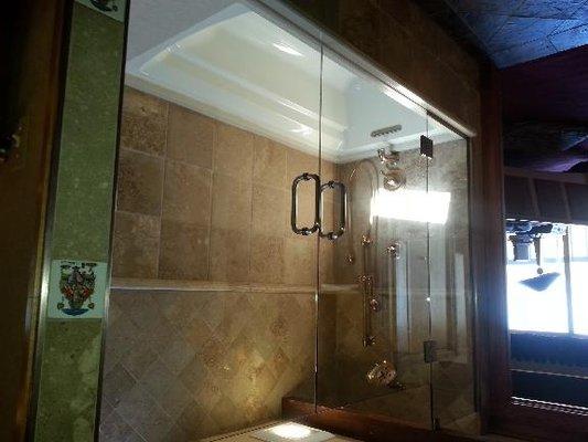 Double European shower doors on tub