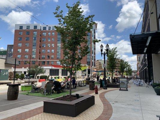 Community outdoor seating outside Foster Coffee Co