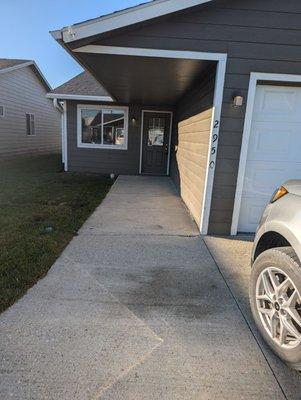 Showing the walk up from the driveway. This is where it looked like people bbq and sit. No backyards. No backdoor.