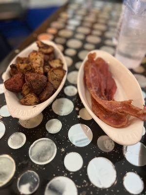 Home potatoes and a side of bacon. They give you 4 pieces of bacon, none under cooked. The potatoes are seasoned to perfection!