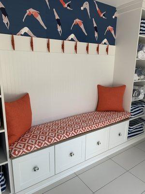 bench cushion and throw pillows in pool changing room