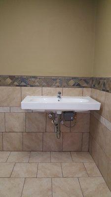 Lavatory wall mount sink and faucet installed in Fairfield, CA.