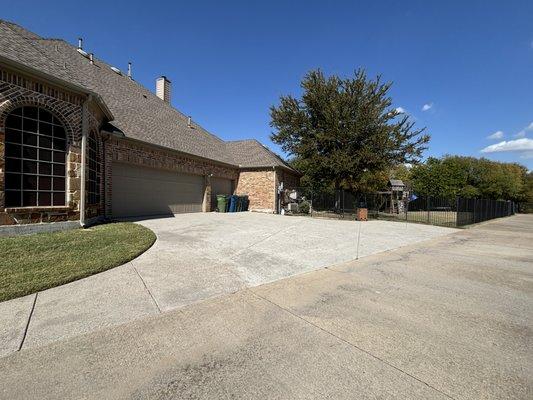 Cleaned the driveway of the house with the sidewalk walkway looks way better you can see difference on the colors of the concrete