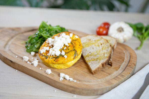 Baked frittata with a side of sourdough and feta cheese