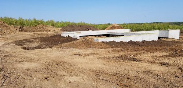 Backfilling foundation near Indianola Iowa