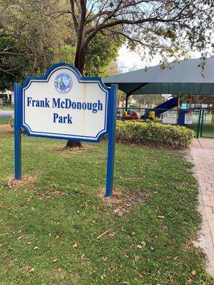 Frank McDonough Park sign by the playground area.