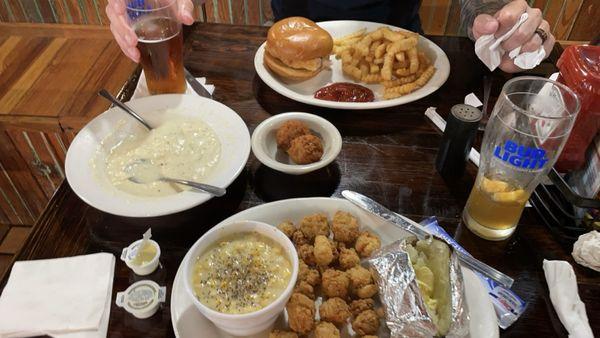 Clam chowder with puppies, gator bites, creamed corn and baked potato, and fried grouper sandwich with fries.