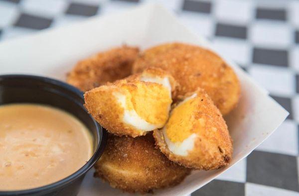 Deep fried deviled eggs with homemade spicy mustard