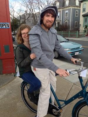 Satisfied customer on his brand new Workcycles Gr8, with his satisfied partner on the back seat, in front of Bicycle Belle.