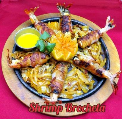 Try the  fresh Shrimp  Brocheta . Served with rice ,Beans, pico de gallo  guacamole & tortillas.