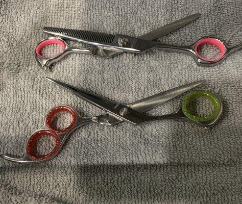 Sharpened scissors and fun color finger inserts for styling shears provided by manny's sharpening.