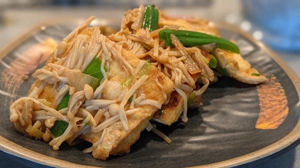 Fresh tofu from Thanh Son cooked with soy sauce, shallots, green onion, enoki mushroom