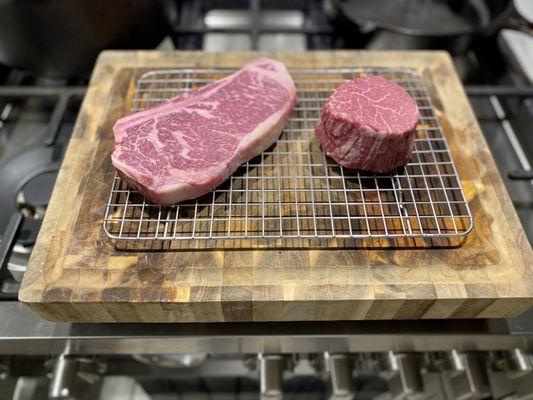 8oz USDA Prime+ Filet on right and 12oz USDA prime bone-in Kansas City Strip on left.