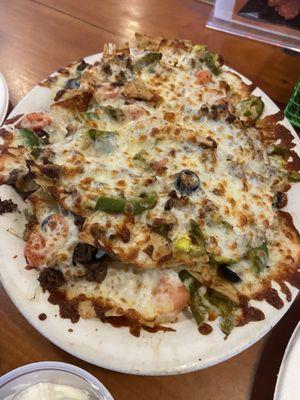 Deluxe Beef Nachos with gooey mozzarella cheese.