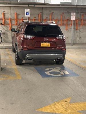 Lady who works the front desk parks in handicap. No handicap tags and the plate doesn't run for a handicap permit.