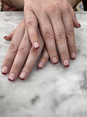 A sophisticated look, with burgundy and silver sparkle French. #gel manicure