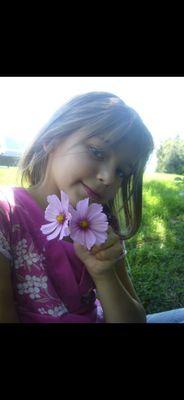 Flowers and a pretty young girl