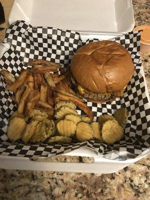 Impossible burger with a side of fries pickles