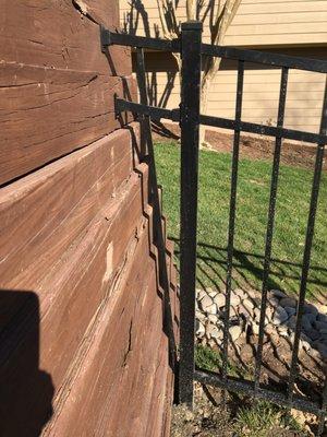 Nice insert to fill gap between fence and retaining wall.