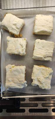 Homemade cheese cake squares .