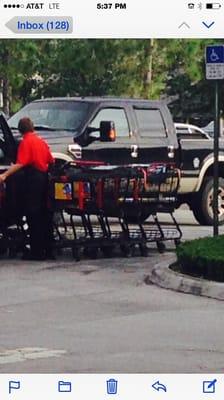 Carts stored in a handicap parking spot