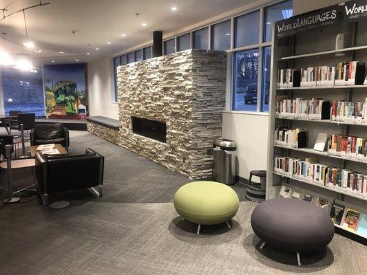 Reading room with small stage and fireplace.