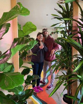 Selfie mirror among the plants and custom floor art!