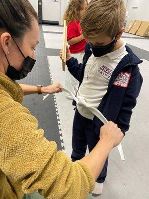 Our friend earning his white belt!!