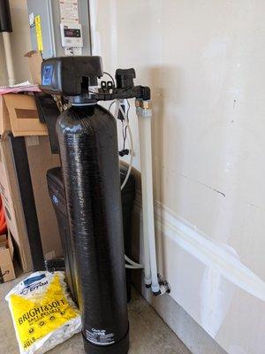 Expert water softener installation, including plumbing of drain lines for both the resin tank and brine overflow