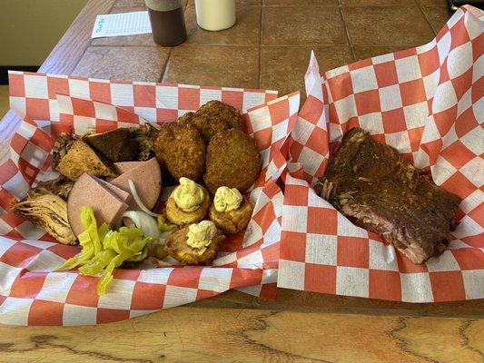 Meat Sampler Platter with deviled eggs, fried green tomatoes and a side of ribs.