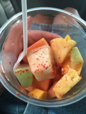 Fruit cup is very well served with pineapple, melon, mango, and watermelon and season with Tajín at a low price