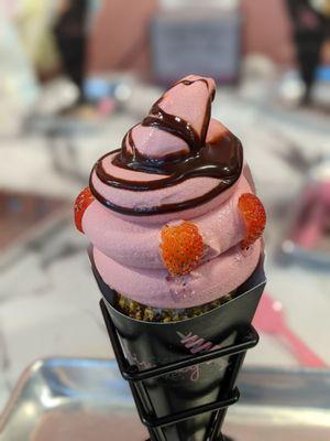 Build your own Dole Whip Strawberry with chocolate syrup in pistachio chimney cake