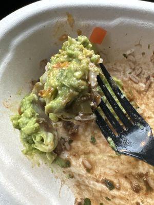 A huge clump of guacamole that tasted old. Paid extra for this just to throw it away.