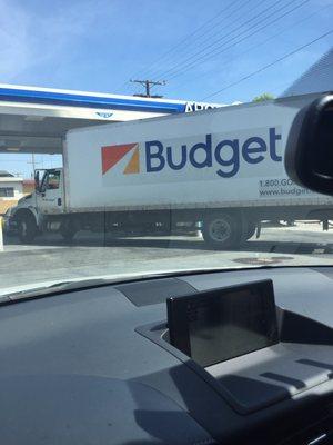 Another truck parked (with no driver) blocking another gas pump.