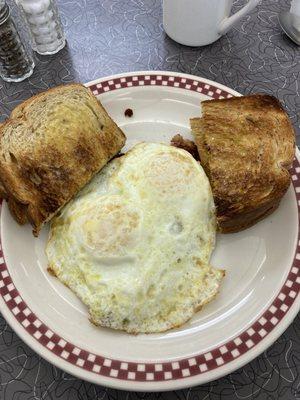 Over-medium eggs over corned beef hash with Rye toast