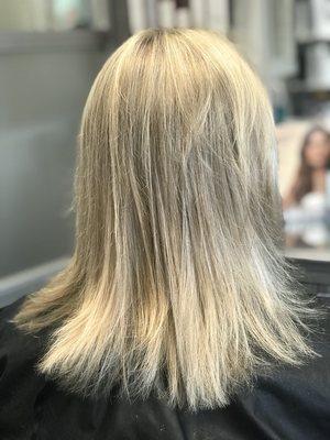 Hair that is thicker, shiny, and full after a 2 year fine thin hair treatment plan.