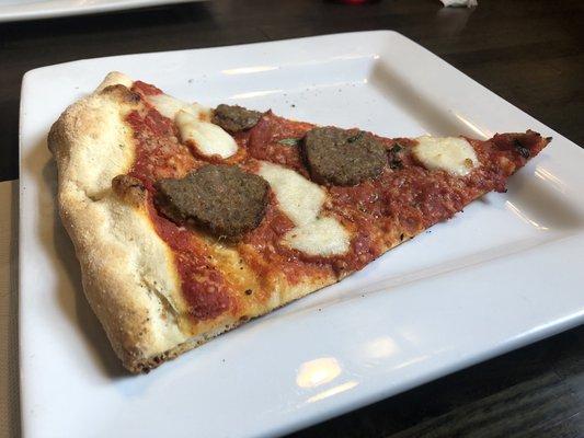 Margarita pizza slice with meatballs