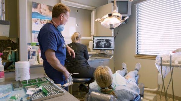 Spokane dentist Dr. Robert Walker explaining dental implants procedure to patient at Cascade Dental Care South Hill