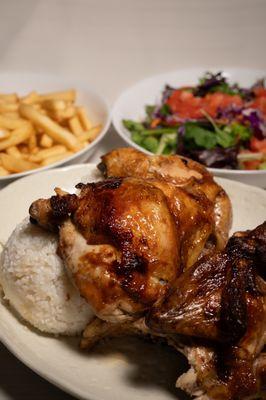 Rotisserie chicken served with two sides of your choice.