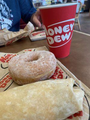 Breakfast burrito, sugar raised donut, and a hot coffee.