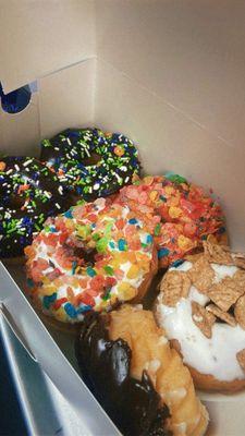 Fruity pebble donuts, Cinnamon Toast Crunch donut, chocolate with sprinkles donut